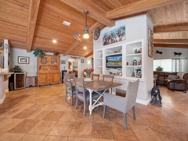 tiled dining area with built in shelves, beam ceiling, and wood ceiling