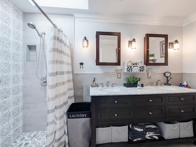 bathroom featuring a shower with curtain, crown molding, and vanity