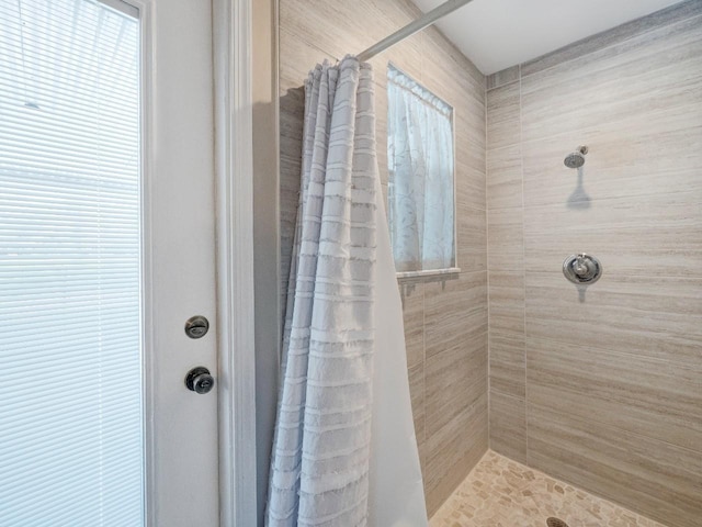 bathroom featuring a shower with curtain