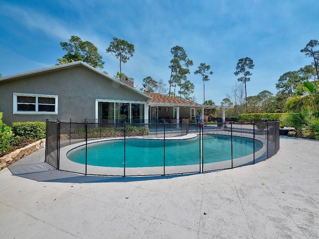 view of pool featuring a patio area