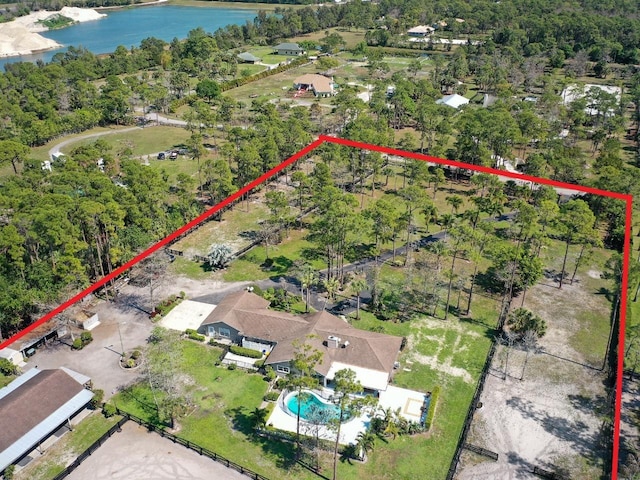 birds eye view of property featuring a water view