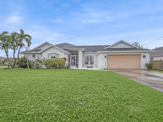 single story home featuring a front yard and a garage