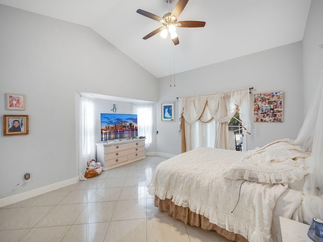 tiled bedroom with ceiling fan and lofted ceiling