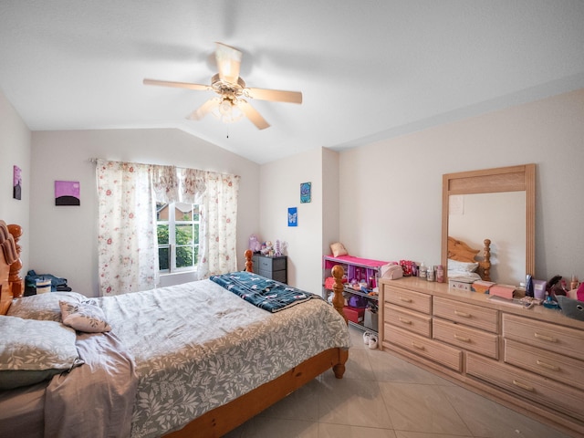 tiled bedroom featuring ceiling fan and lofted ceiling