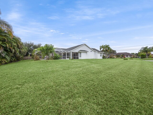 view of yard featuring a lanai