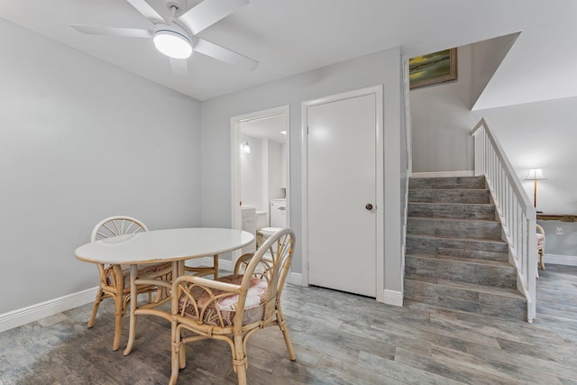 dining space with hardwood / wood-style flooring and ceiling fan