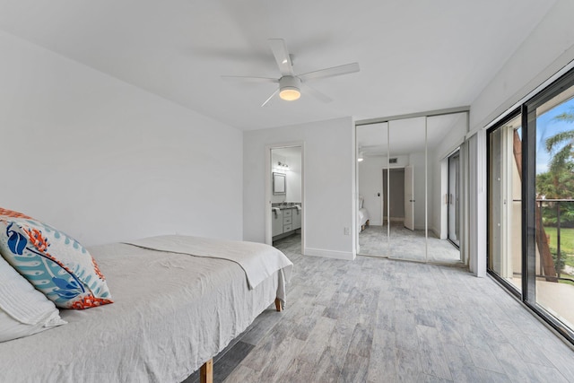 bedroom with hardwood / wood-style floors, ensuite bathroom, ceiling fan, access to exterior, and a closet