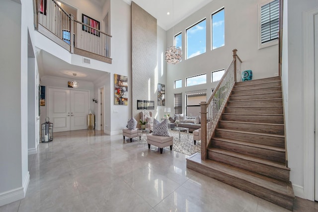 foyer entrance with a towering ceiling