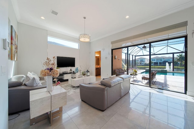 living room with ornamental molding and light tile patterned floors