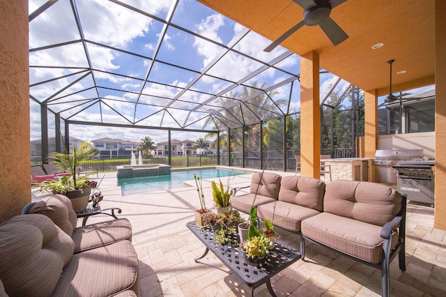 view of patio / terrace with a lanai, area for grilling, ceiling fan, and a swimming pool with hot tub