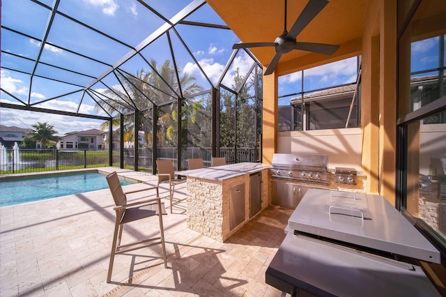 exterior space with ceiling fan, an outdoor kitchen, a lanai, grilling area, and a fenced in pool