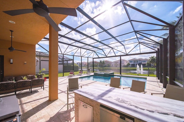 view of patio with a lanai, an in ground hot tub, an outdoor bar, and an outdoor hangout area