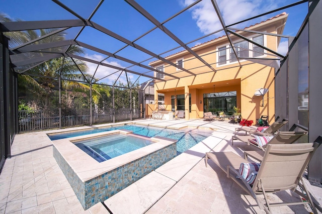 view of swimming pool with an in ground hot tub, glass enclosure, and a patio area