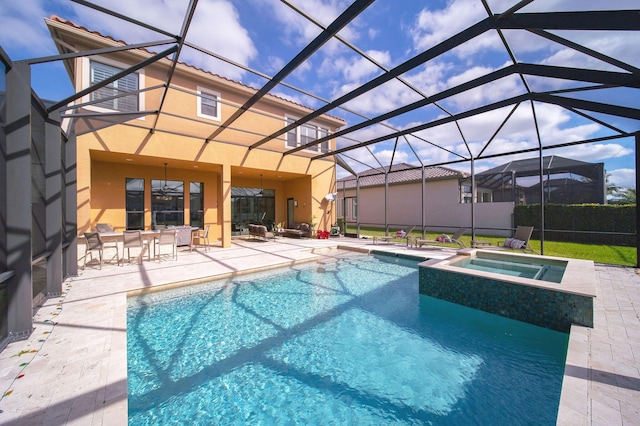 view of pool with a lanai, an in ground hot tub, and a patio