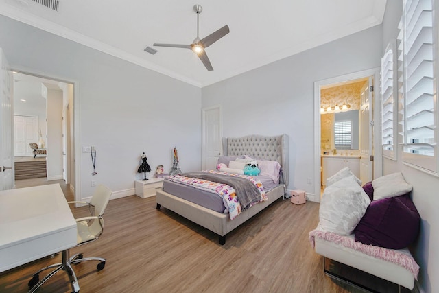 bedroom with ceiling fan, light wood-type flooring, ornamental molding, and ensuite bath