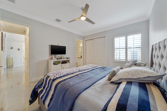 tiled bedroom featuring ceiling fan, a closet, and ornamental molding