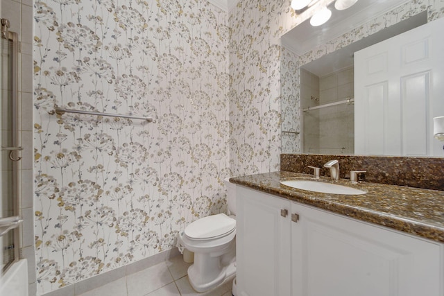 bathroom featuring tile patterned flooring, vanity, and toilet