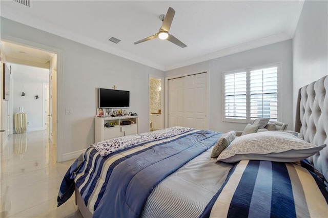 tiled bedroom featuring ceiling fan, a closet, and crown molding