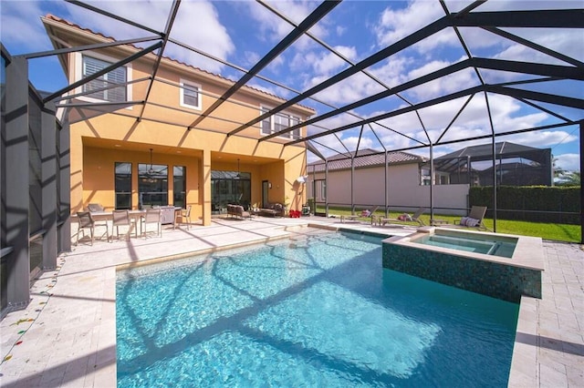 view of swimming pool featuring an in ground hot tub, a patio, and a lanai