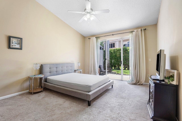 carpeted bedroom featuring ceiling fan, access to exterior, a textured ceiling, and vaulted ceiling