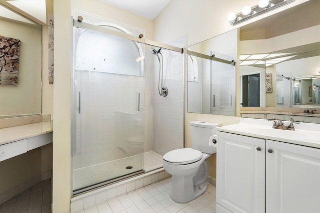 bathroom with tile patterned floors, vanity, toilet, and a shower with shower door