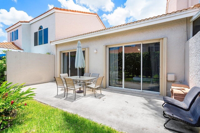 rear view of property featuring a patio