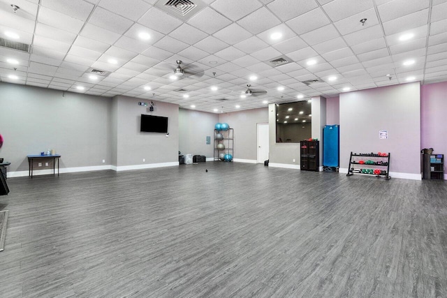 workout room featuring hardwood / wood-style floors and ceiling fan