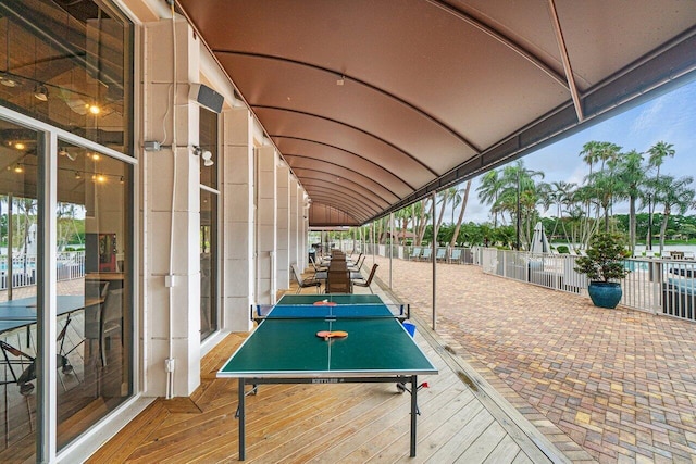 game room with floor to ceiling windows