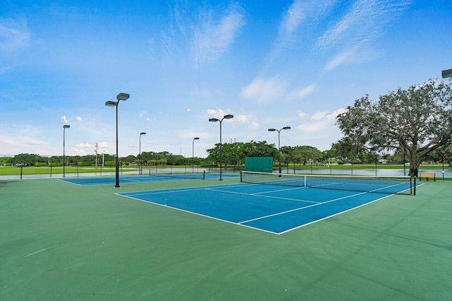 view of sport court with basketball hoop