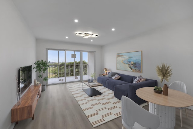 living room with recessed lighting and wood finished floors