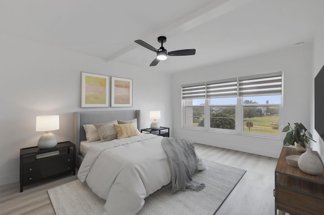 bedroom with ceiling fan and light wood-type flooring