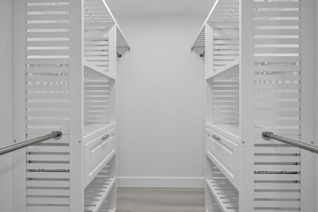 walk in closet featuring light hardwood / wood-style flooring