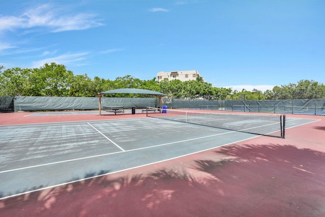 view of sport court featuring basketball hoop