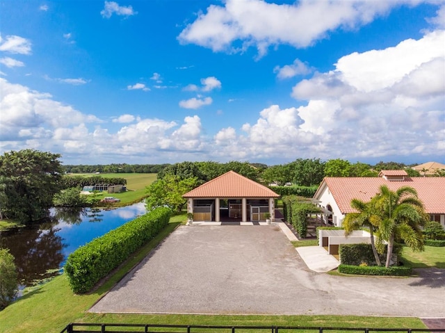 view of front of property featuring a water view and a front yard