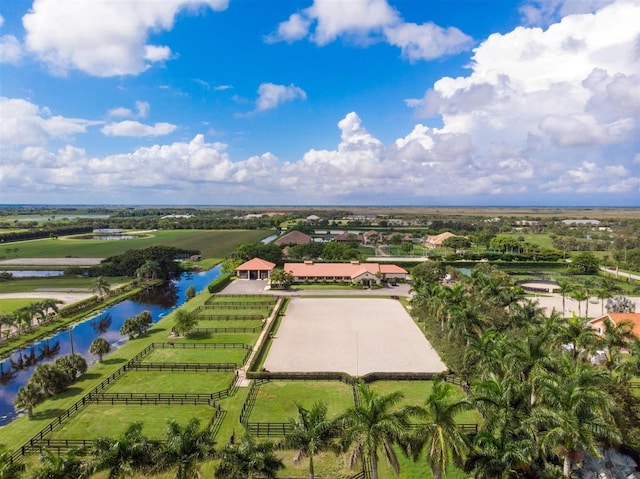 birds eye view of property with a water view and a rural view