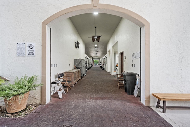 corridor featuring a high ceiling