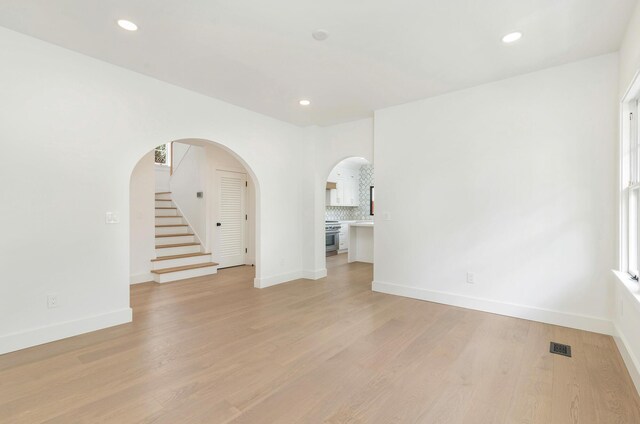 spare room featuring light hardwood / wood-style flooring