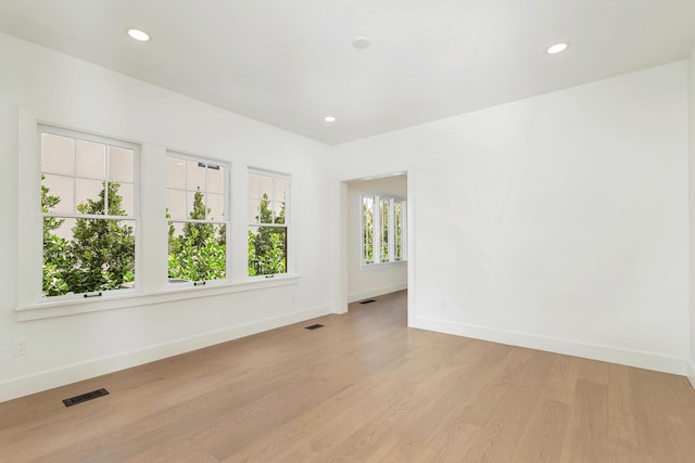 unfurnished room featuring light hardwood / wood-style floors