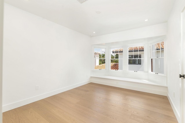 spare room featuring light wood-type flooring