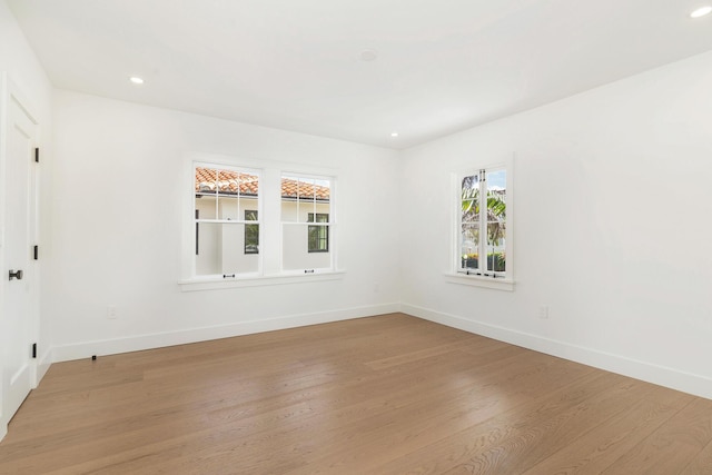 unfurnished room featuring light hardwood / wood-style flooring