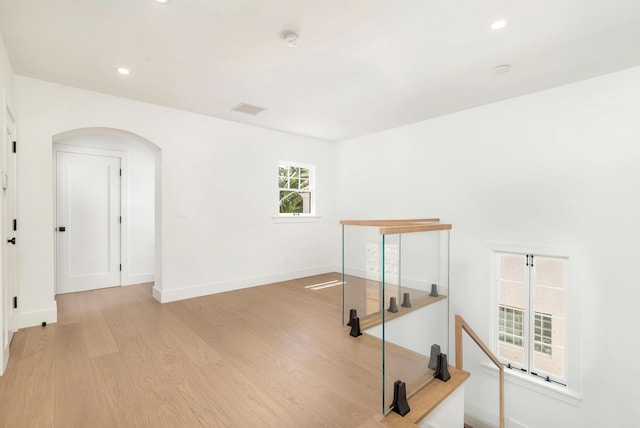 spare room featuring light hardwood / wood-style flooring