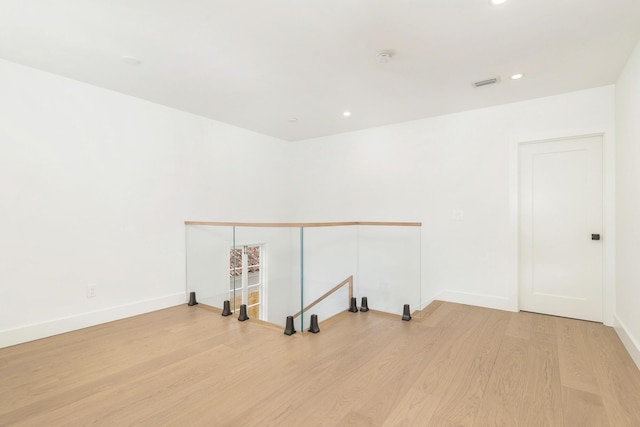 spare room featuring light hardwood / wood-style floors