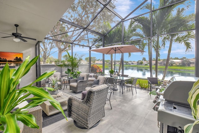 view of patio / terrace with glass enclosure, an outdoor living space, a water view, and ceiling fan