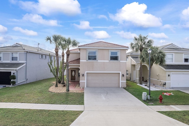 view of front of home with a front yard and a garage