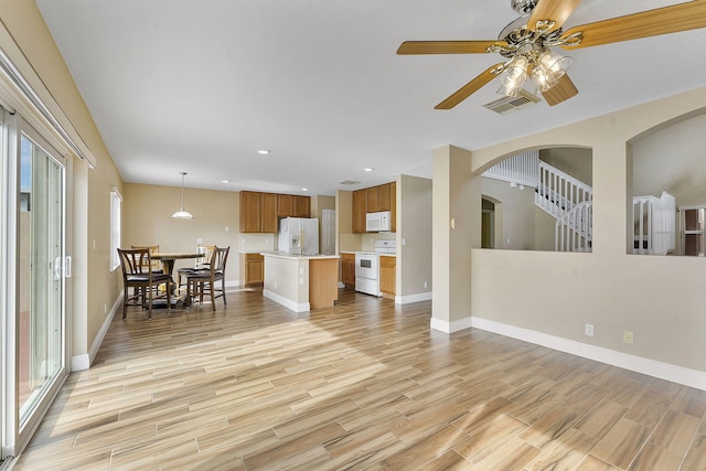 living room featuring ceiling fan