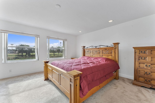 bedroom with light carpet