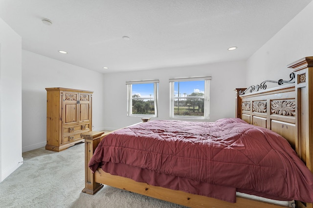 bedroom with light colored carpet