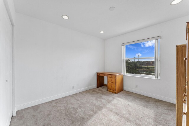 unfurnished bedroom with light carpet