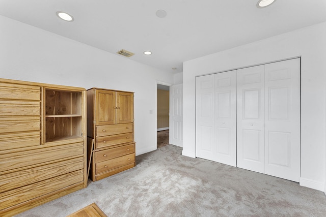 unfurnished bedroom with carpet and a closet