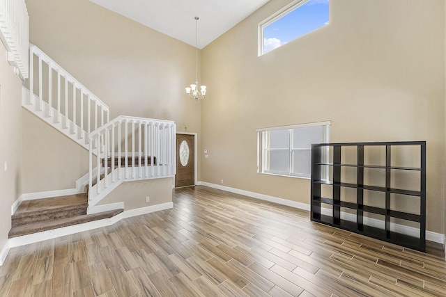 interior space featuring a high ceiling and an inviting chandelier